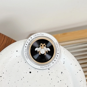 Close-up of pearl flower bee phone grip with Gift For You print on circular frame
