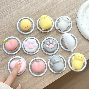 Cute cartoon animal squishy phone grip set featuring chick, cat paw and peach shapes