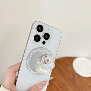 Detail of white phone socket with sparkling rhinestones and a metal star accent