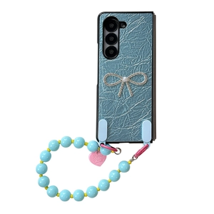 Custodia blu per Samsung Z Flip6 con fiocco di strass e cinturino da polso in perle