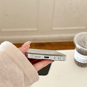 Close-up of precise cutouts and speaker holes on translucent dark gray phone case