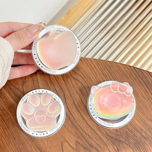 Detail of holographic iridescent phone sockets in apple and cat paw shapes on wood