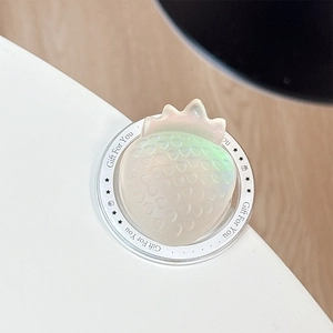 Detail of laser iridescent strawberry phone grip on a clear base with Gift For You text