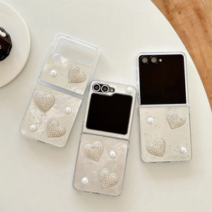 Detail of luxury pearl and diamond heart decor for Galaxy Z Flip foldable phone case