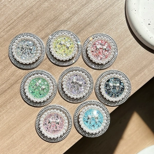 Sparkling pearl bow phone sockets in 8 colors on wood surface with rhinestone details