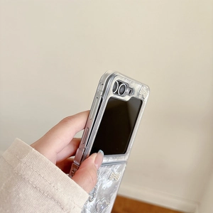 Detail view of silver pearl texture case for Samsung Z Flip with rhinestone bow