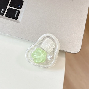 Detail of floral resin magnetic phone grip with green flowers and white pearl