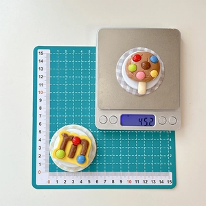 Detail view of 3D creative chocolate bean phone sockets on measuring scale
