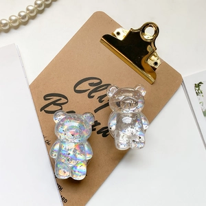 Close-up of holographic silver foil bear phone grip with premium resin finish and 3D texture