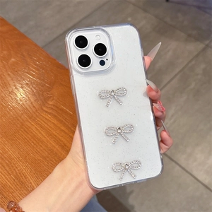 Close-up of glitter iPhone case with three sparkling rhinestone bowknot decorations