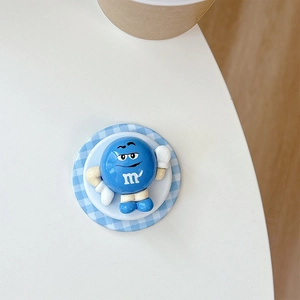Blue cartoon character mobile phone socket holder with white glove and m letter logo