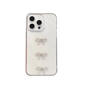 Sparkly transparent iPhone case featuring three silver glitter bow accents for a chic look