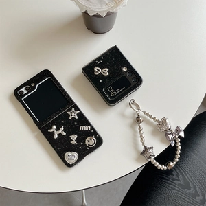 Custodia nera glitterata con stelle e smiley per Samsung Galaxy Z Flip con cinturino
