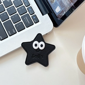 Détail du support de téléphone en cuir en forme d'étoile avec motif yeux et Smile