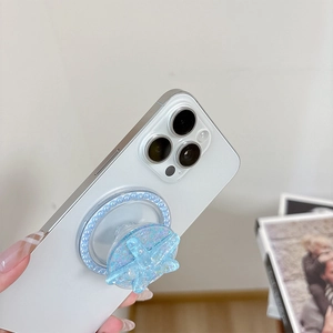 Makro-Detail von Glitzer-Seestern Handy-Sockel mit Perlenbasis auf weißem Smartphone