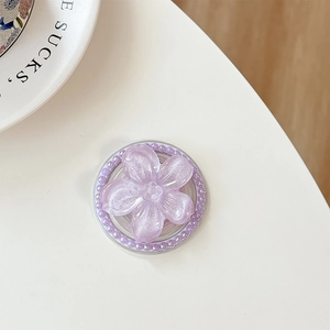 Detail of purple flower MagSafe phone stand with glitter finish and beaded edge decor