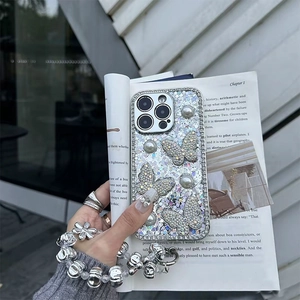 Glitter iPhone case with rhinestone butterflies and pearls featuring a silver beaded lanyard