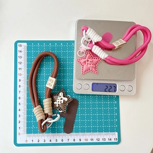 Detailed view showing braided phone lanyard length of 15cm and weight of 22.7g
