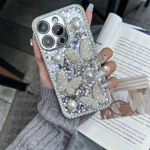 Sparkly silver iPhone case featuring 3D glitter butterflies and large faux pearls