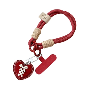 Red braided phone strap with heart pendant and smiley slider on white background