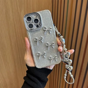 Silver glitter iPhone case with metallic 3D bows and heart bead charm lanyard