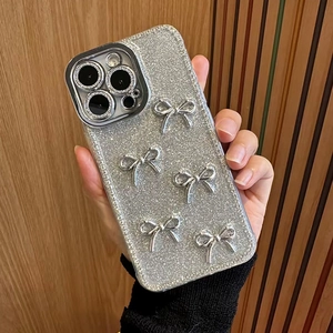 Sparkling silver glitter phone case for iPhone 16 Pro Max featuring 3D bow decorations