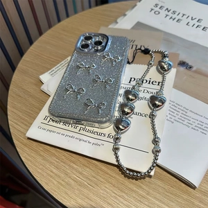 Silver glitter phone case with 3D bows and matching heart beaded lanyard charm set