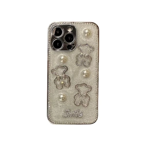 Sparkly white iPhone case with pearl bear charms and rhinestone Smile lettering