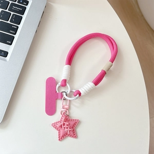 Close-up of a pink braided phone lanyard with star charm and secure connector pad