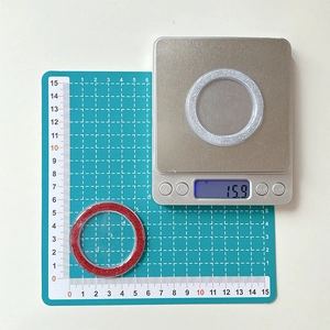 Detail showing red and silver glitter phone grip bases measuring 5cm in diameter