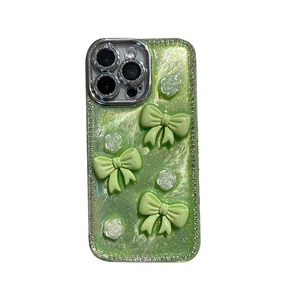 Sparkly green iPhone case with 3D bows, white roses and rhinestones for 16 Pro Max