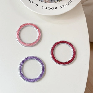 Set of three glitter phone camera protectors in pink, red, and purple metallic finish