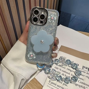 Sparkly light blue iPhone case with large pearl flower and matching beaded hand strap lanyard