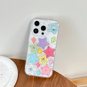 Detail of clear iPhone case with 3D colorful macaron stars on a wooden surface