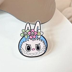 Close-up of blue cartoon acrylic pop socket featuring floral decor and 3D ears
