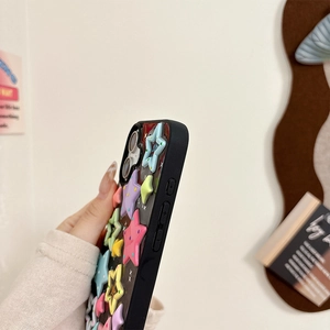 Side view of iPhone case with colorful 3D resin stars and precise button cutouts