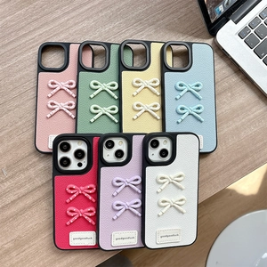 Minimalist leather bow iPhone case with litchi texture in seven vibrant colors