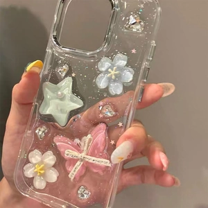Detail of iPhone case featuring 3D pink butterfly, green star, and glitter accents