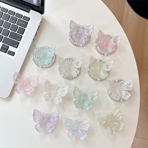 Colorful 3D butterfly phone grip sockets with iridescent finish and pearl rhinestone base
