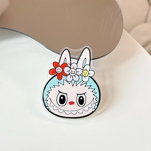 Detail shot of acrylic cartoon rabbit phone stand with colorful flower embellishments