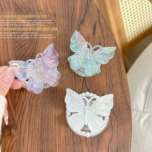 3D colorful butterfly phone sockets in purple, teal, and white with glitter finish
