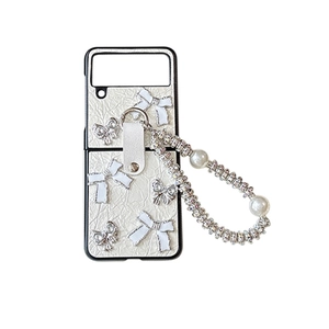 Litchi pattern phone case with white ribbon bow and pearl handle for folding smartphones