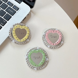 Detail of heart acrylic mirror phone grips with rhinestones and Wish engraving