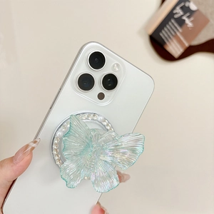 Detail of colorful butterfly phone grip with pearls and rhinestones on a white phone