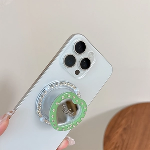 Magnetic heart-shaped phone grip with rhinestones and Wish acrylic mirror on iPhone