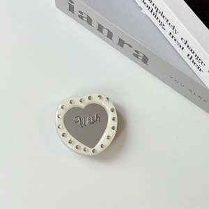 Detail of heart-shaped magnetic phone grip with acrylic mirror, rhinestones and Wish text