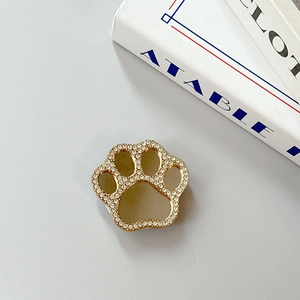 Close-up of cat paw phone grip with crystal rhinestones and integrated makeup mirror