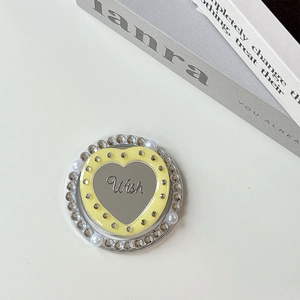 Detail of heart mirror phone grip with rhinestones, pearls and engraved Wish text