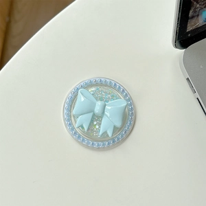 Detail of light blue bow magnetic phone grip with elegant pearl border and glitter finish