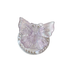 Chic 3D holographic butterfly phone grip with rhinestones and pearl base on white background